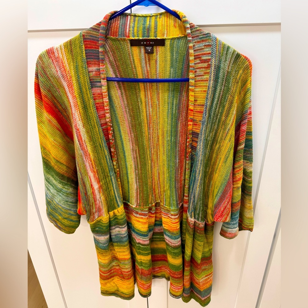 Super cute bright, colorful, comfy sweater. Size small, and made by Fever.